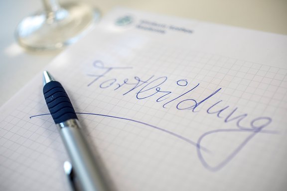 Block und Stift mit dem Schriftzug Fortbildung