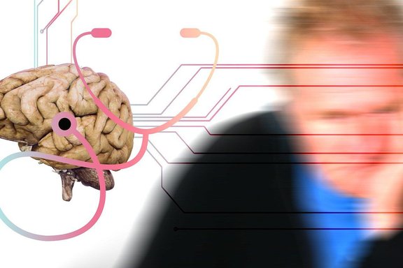 Im Vorgergrund Abbildung eines Gehirns, im Hintergrund eine nachdenkliche, verschwommene Person